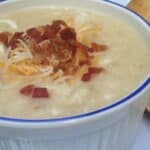 bowl of cream potato and cauliflower cheesy soup