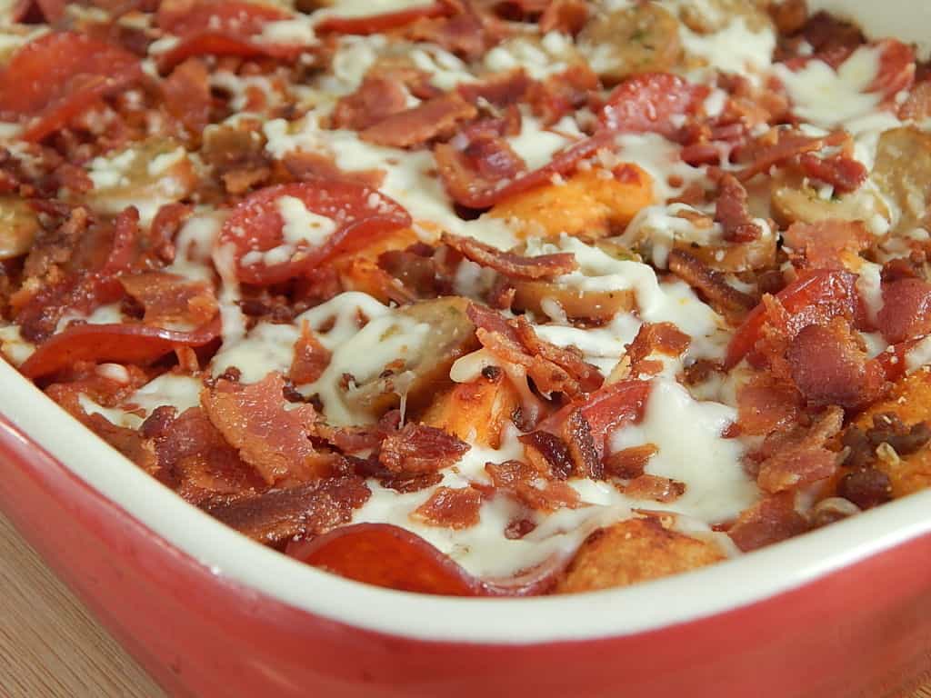 Bubble up pizza casserole in red dish