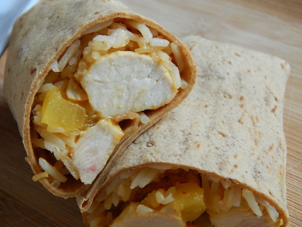 pineapple chicken wraps stacked on top of each other