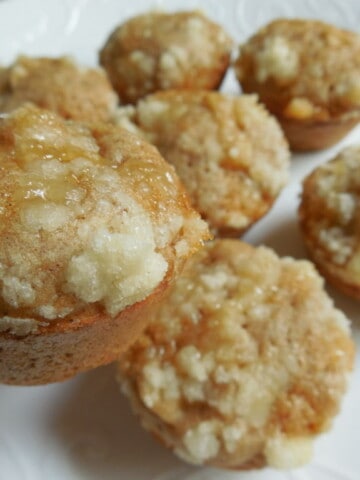 mini apple crumble muffins on white plate
