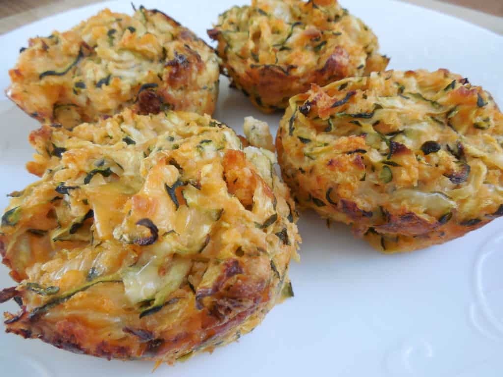 zucchini muffins on white plate