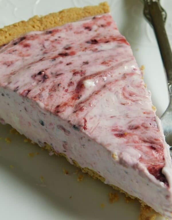 weight watchers friendly berry cheesecake with fork on white plate