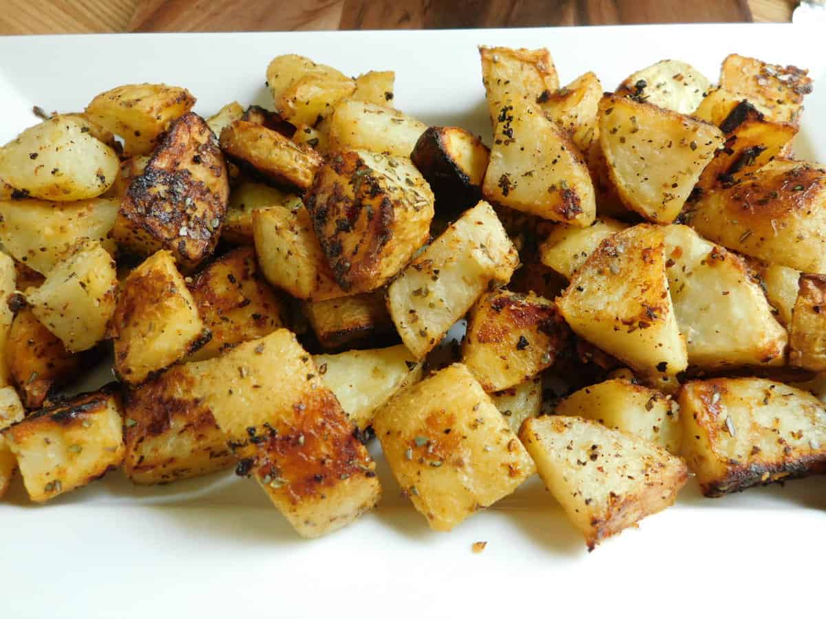 Parmesan Potatoes on White Plate