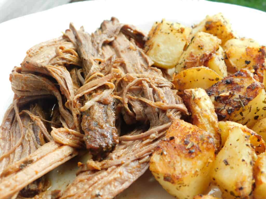 cooked brisket and potatoes