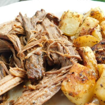 cooked brisket and potatoes