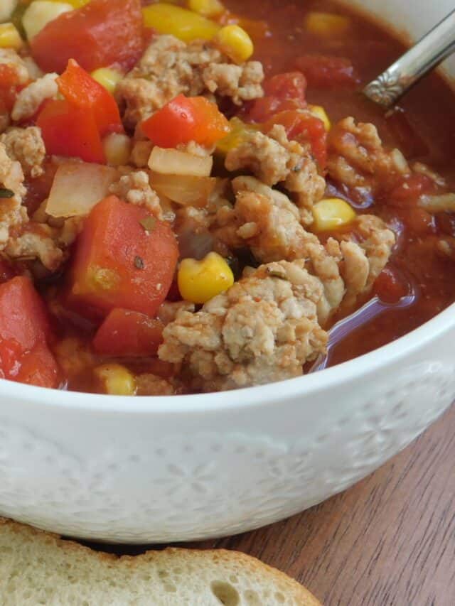 spicy chicken chili in white bowl 