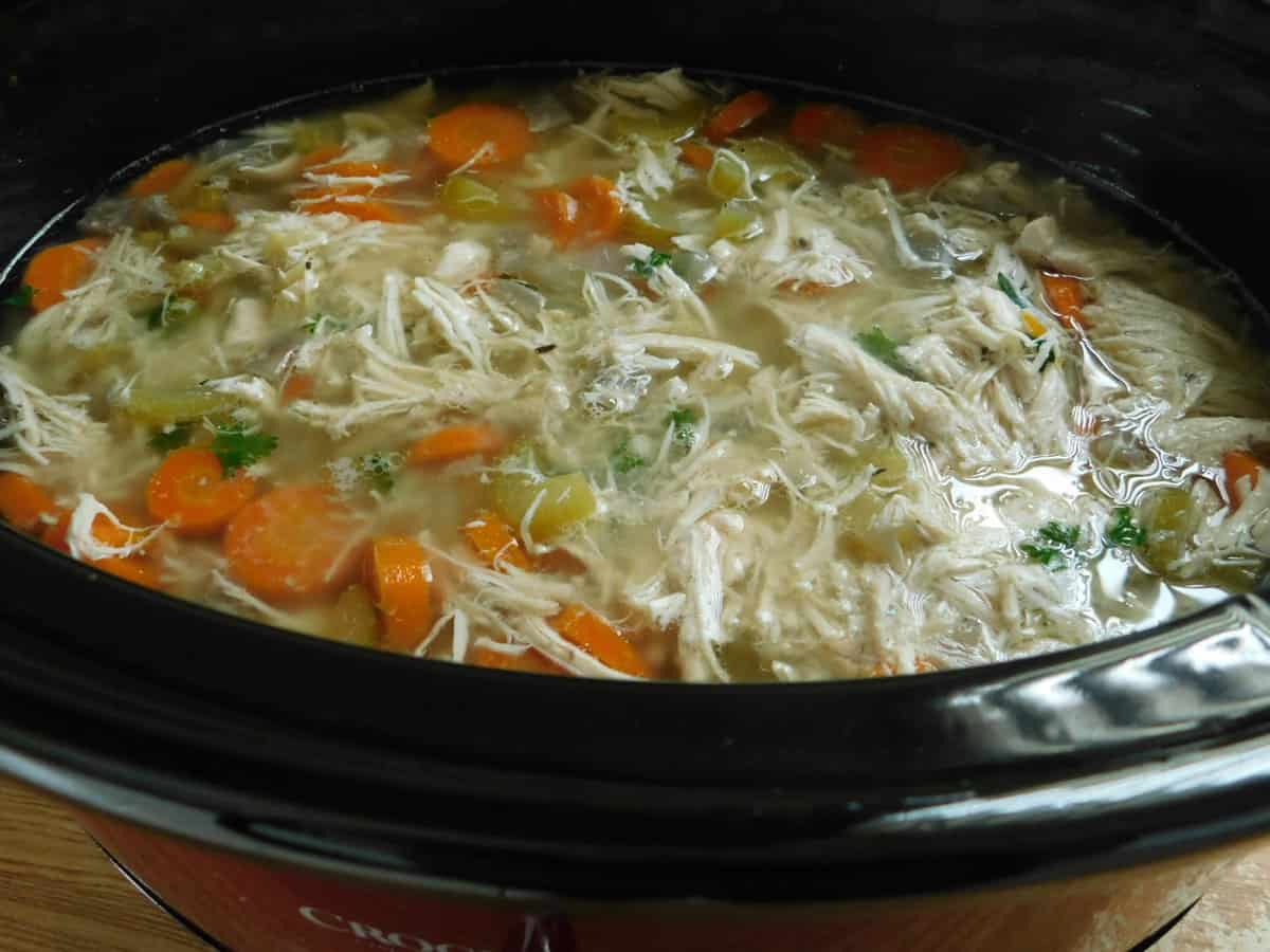 crock pot full of chicken noodle soup 