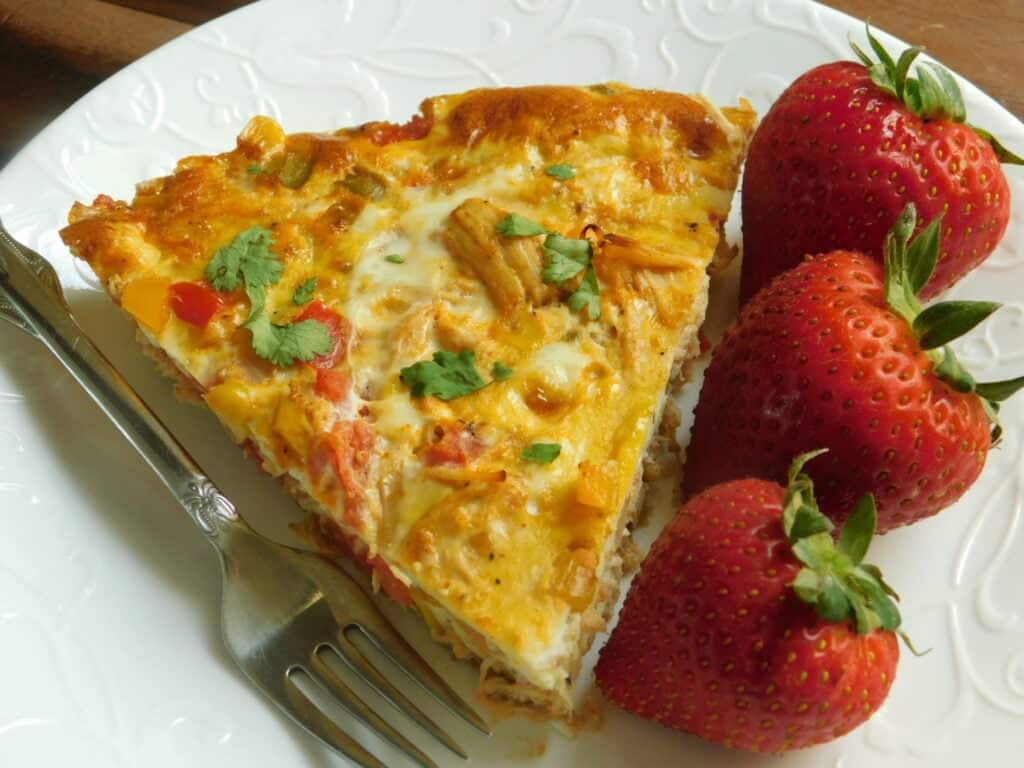 slice of southwest chicken frittata with peppers and corn