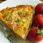southwestern frittata with strawberries on a white plate