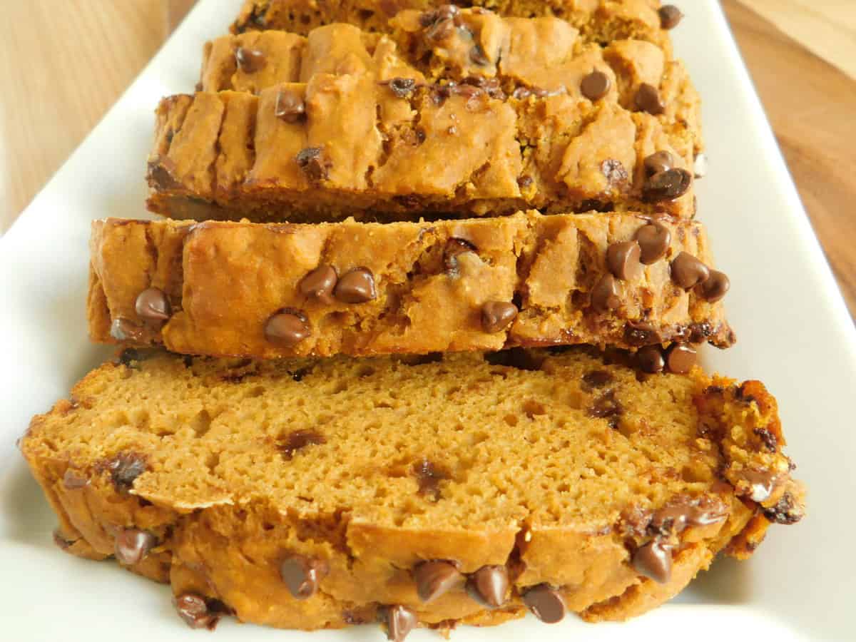 peanut butter chocolate chip pumpkin loaf on white plate