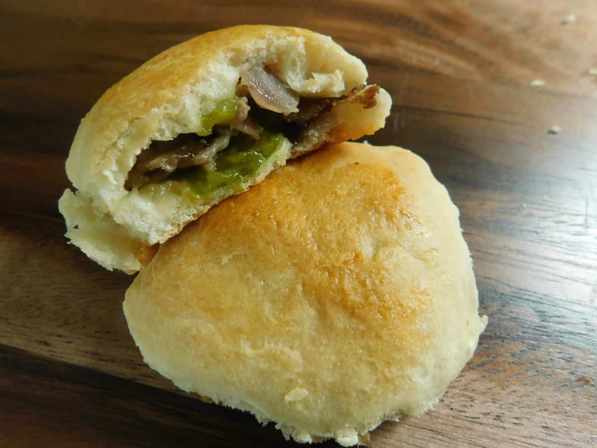 philly cheesesteak biscuit bites on wooden cutting board