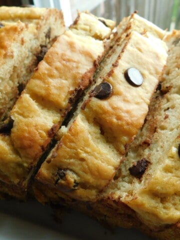 chocolate chip banana loaf, sliced on white plate