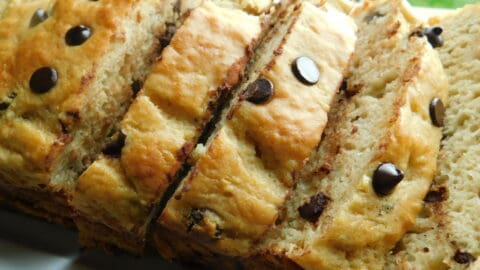 chocolate chip banana loaf, sliced on white plate