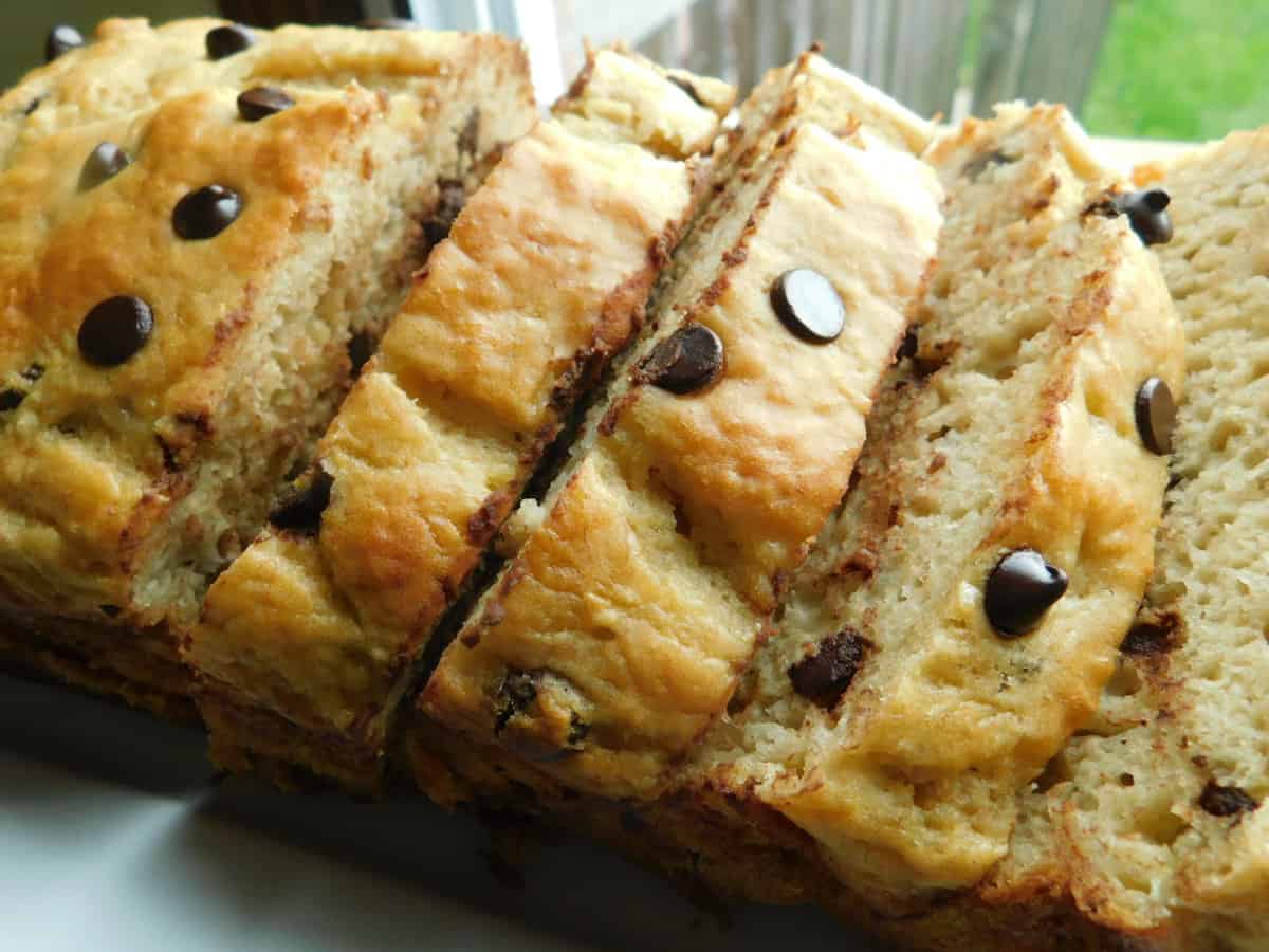 chocolate chip banana loaf, sliced on white plate