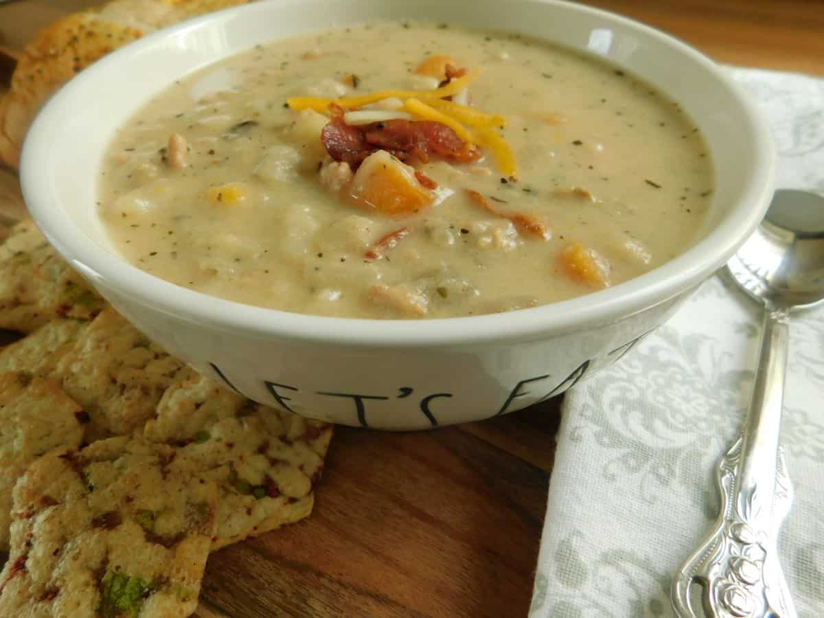 bacon cheeseburger soup in white bowl