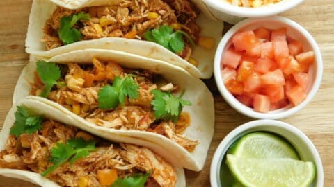 three southwest chicken tacos with toppings