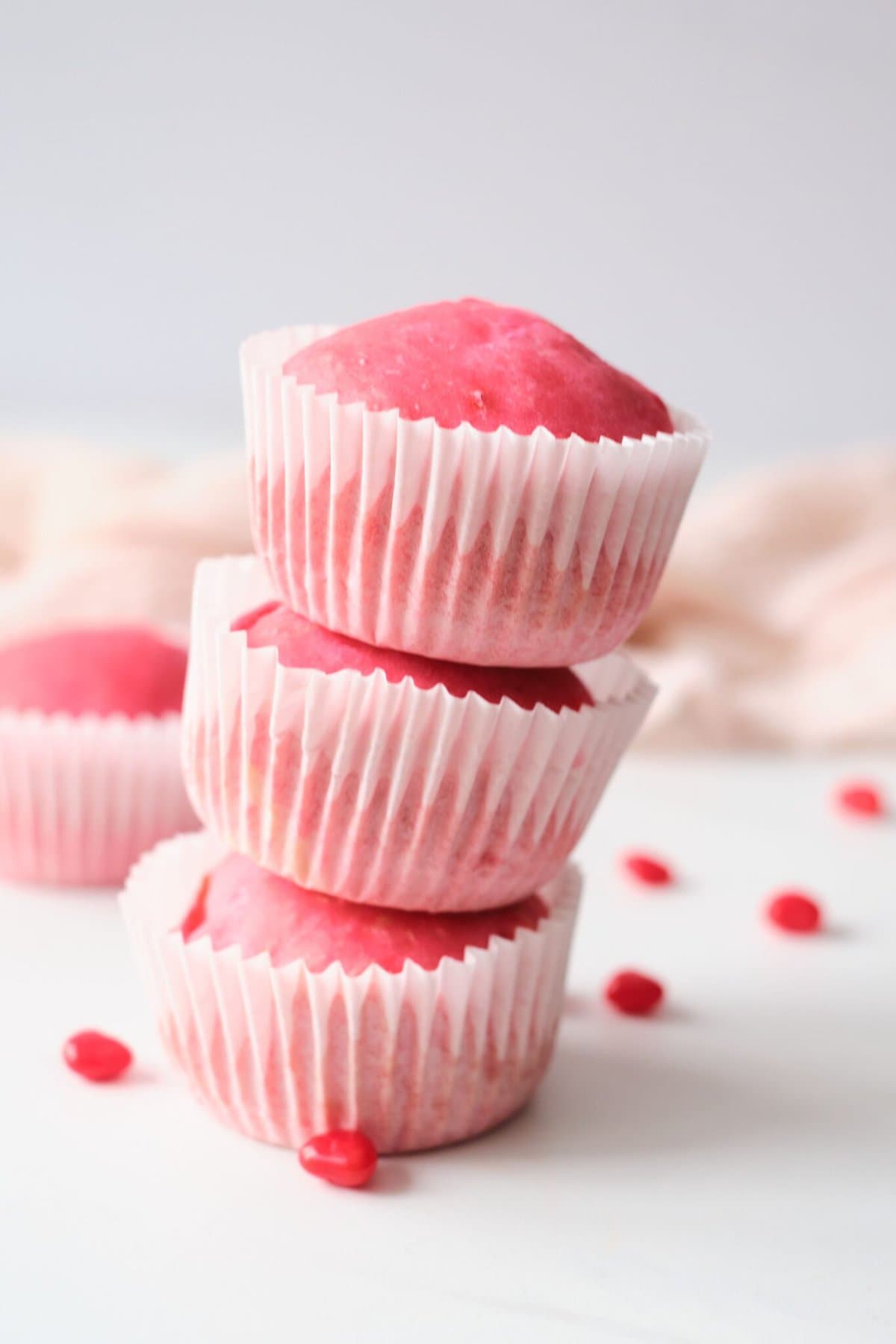 3 cherry cupcakes stacked on top of each other