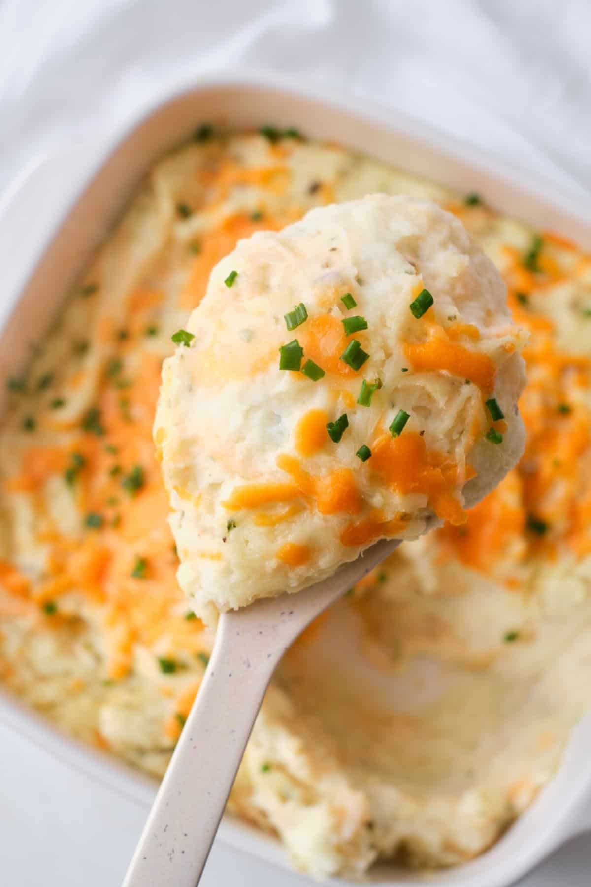 Cheese Garlic Potatoes  on white spoon