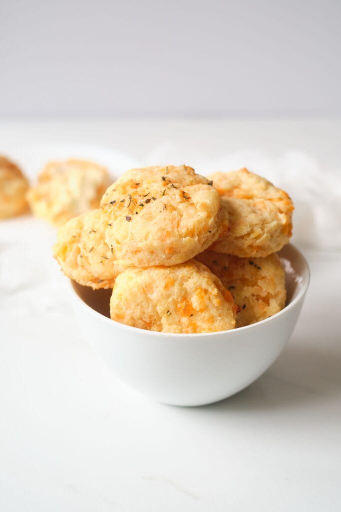 cheddar biscuits in white bowl