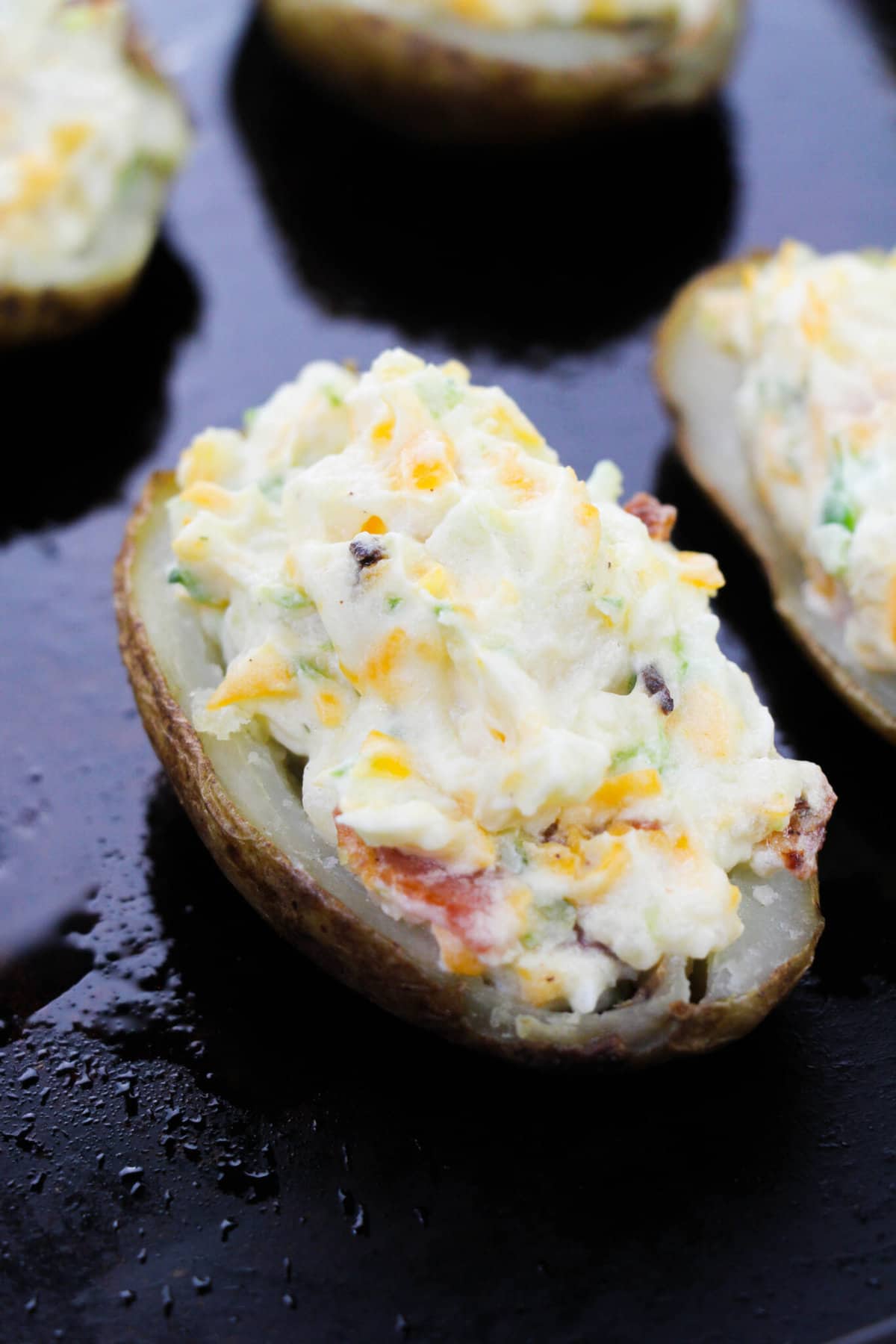 jalapeno popper potato on black counter