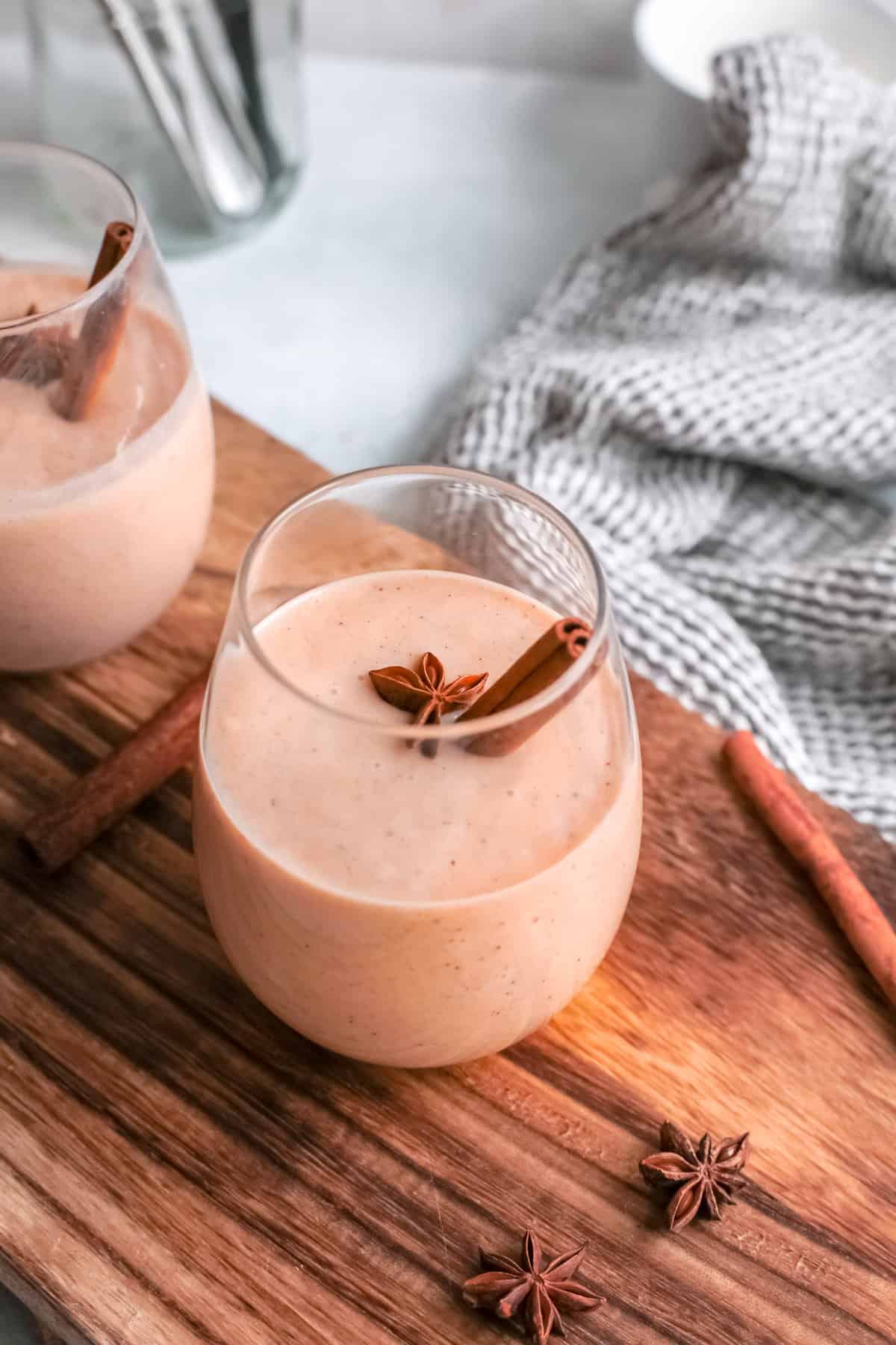 pumpkin pie smoothie on wood cutting board