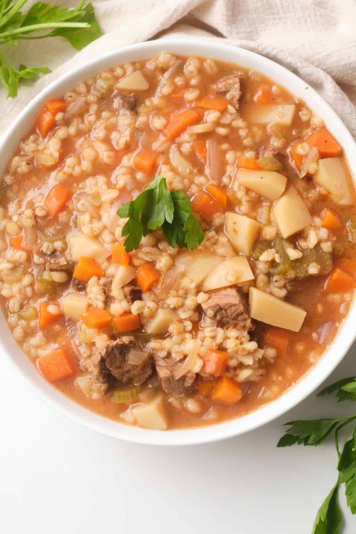ww Beef and barley soup in white bowl