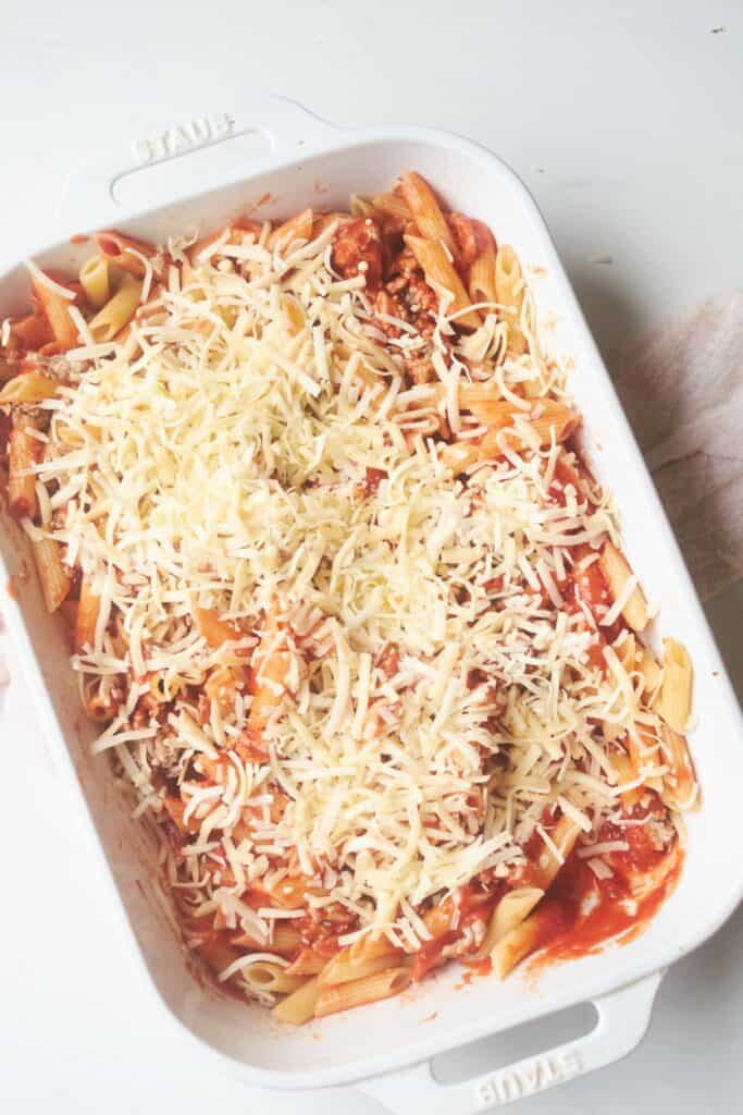 Penne pasta with ground turkey after adding the shredded mozzarella cheese. 