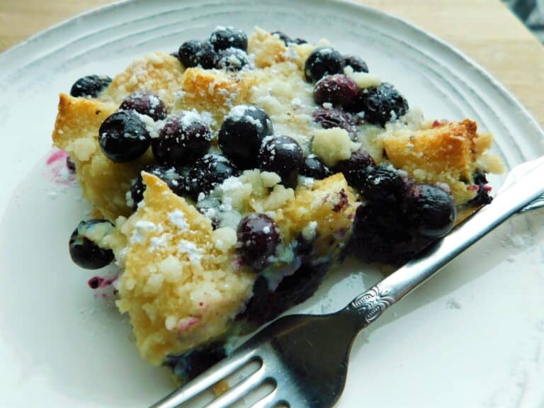 Blueberry maple breakfast biscuit bake on plate with fork. 