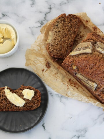 Banana bread loaf with one piece cut out