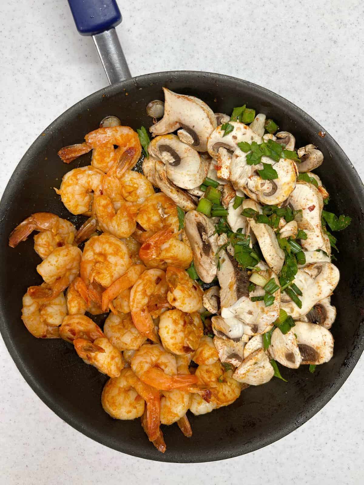 cooked chipotle shrimp and veggies in a skillet