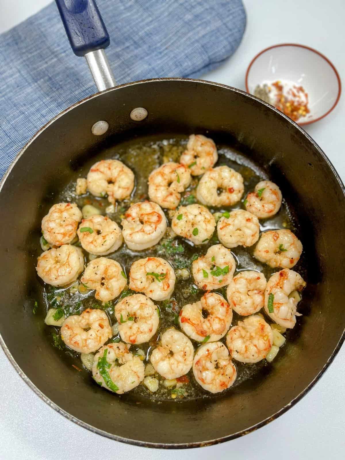 cooked shrimp scampi in cooking pan
