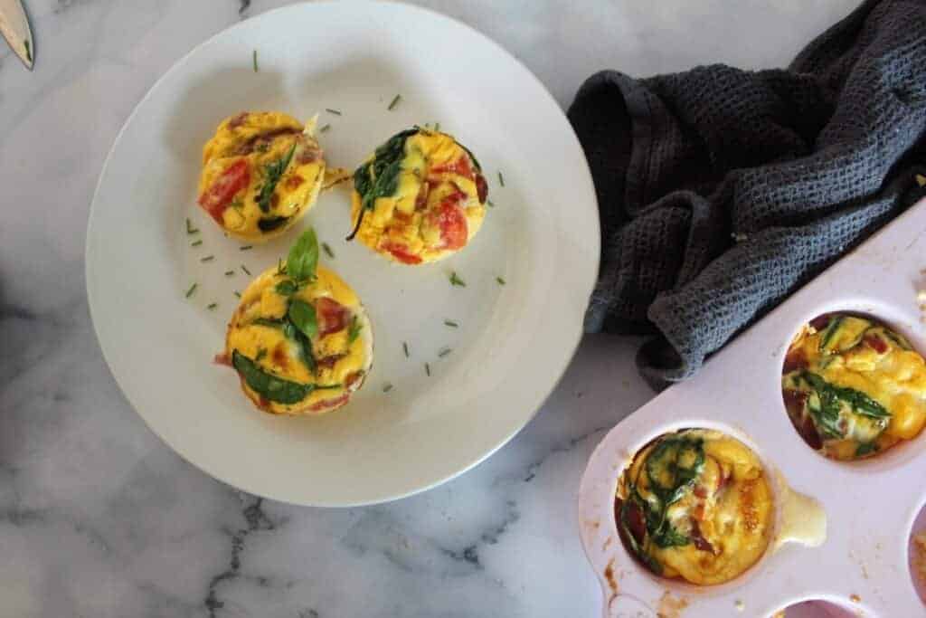 Weight Watchers egg bites with ham, spinach and parmesan on a plate