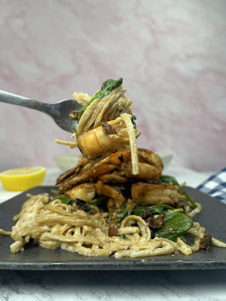 weight watchers shrimp alfredo being raised on a fork