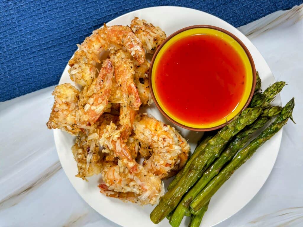 cooked coconut shrimp and asparagus