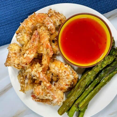 cooked coconut shrimp and asparagus