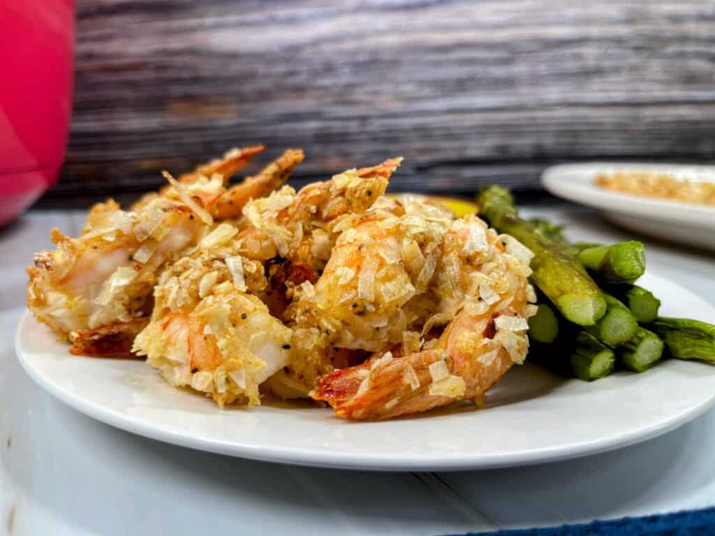 cooked coconut shrimp and asparagus close up