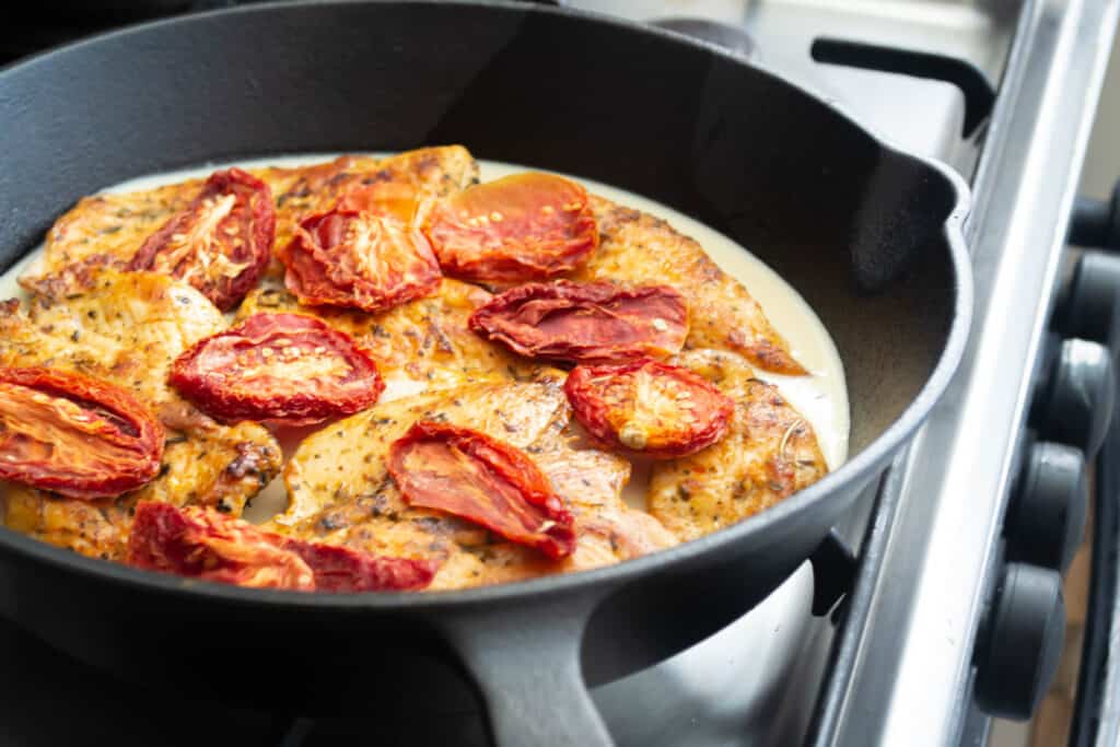 tuscan chicken cooking in pan