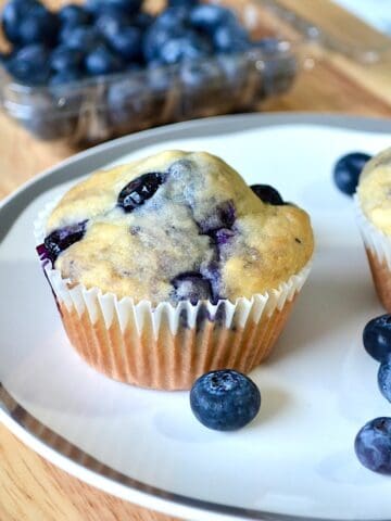 low calorie blueberry muffins on white plate