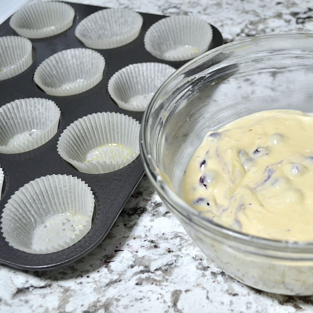 Blueberry muffin batter and muffin tray
