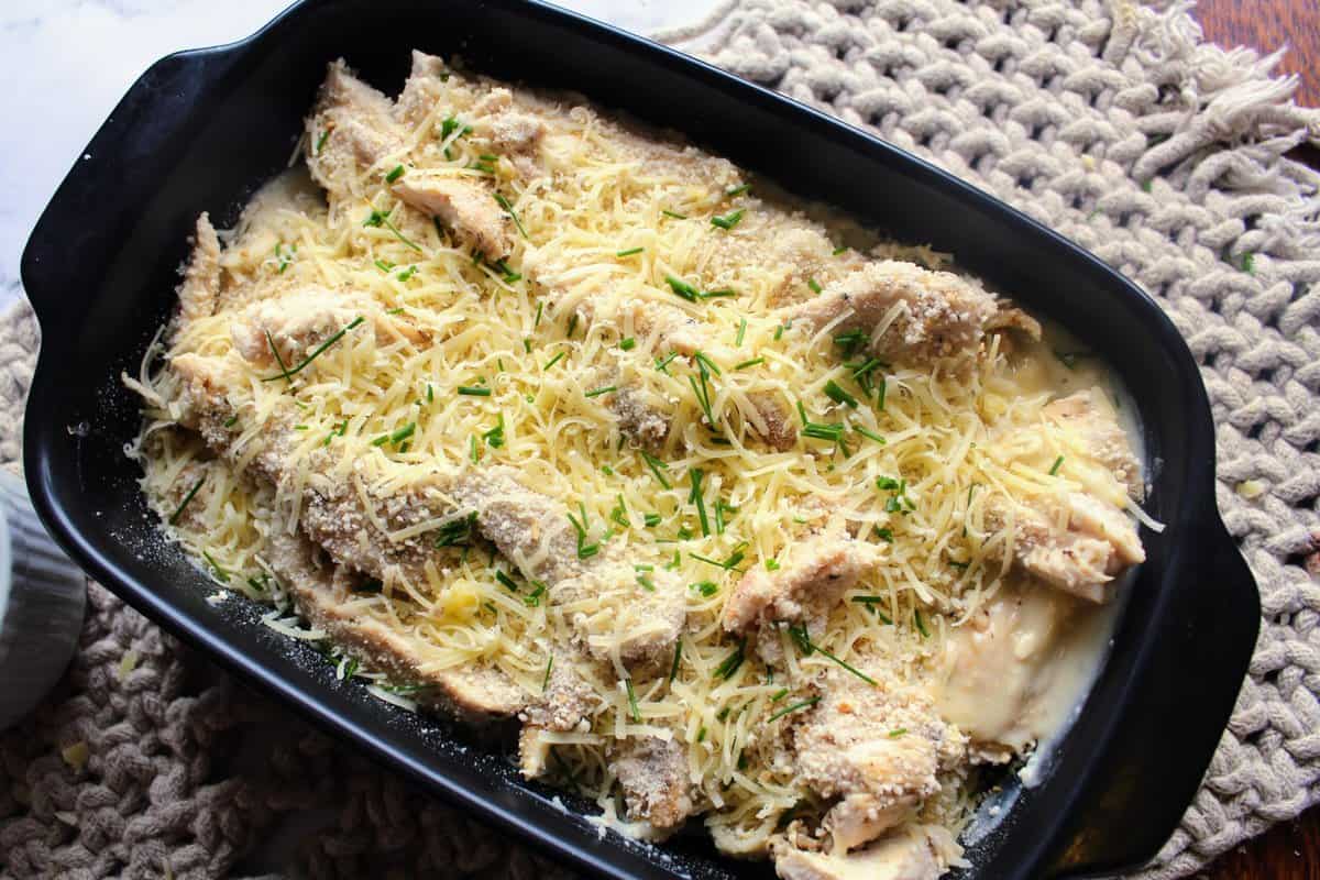 Asiago Tortelloni topped in baking tray sprinkle with the breadcrumbs and parmesan