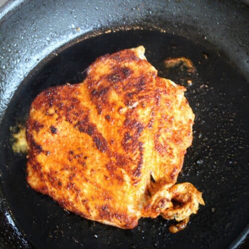 Blackened chicken in saucepan