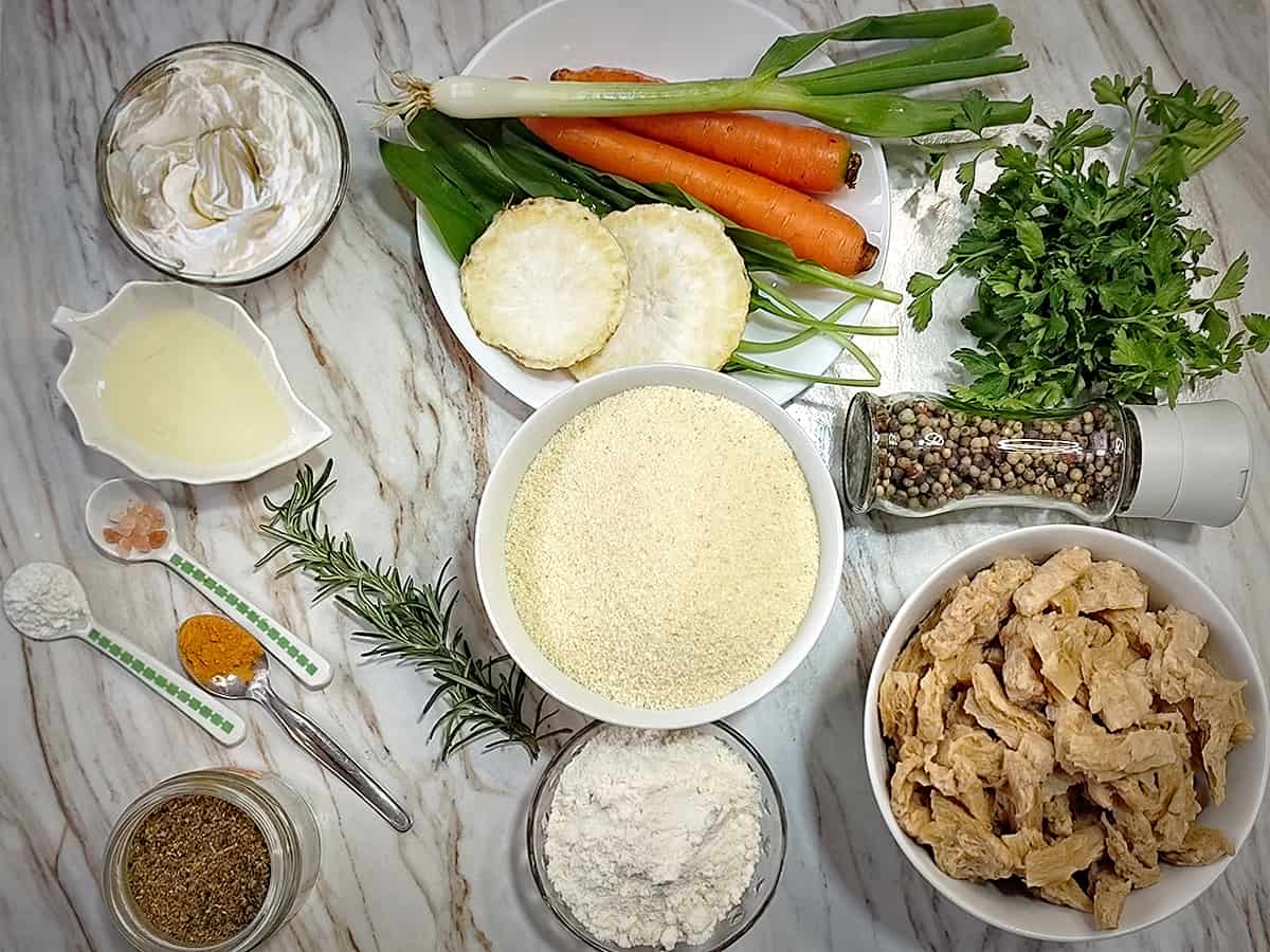 Ingredients for homemade vegan chicken and dumplings on white counter
