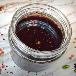 Vegan Worcestershire Sauce in jar on white counter