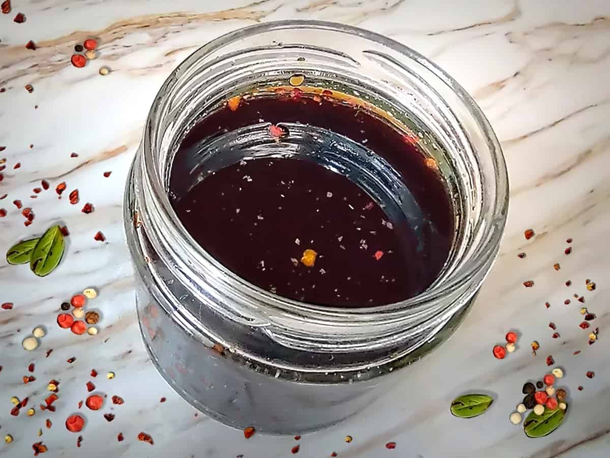 Vegan Worcestershire Sauce in jar on white counter