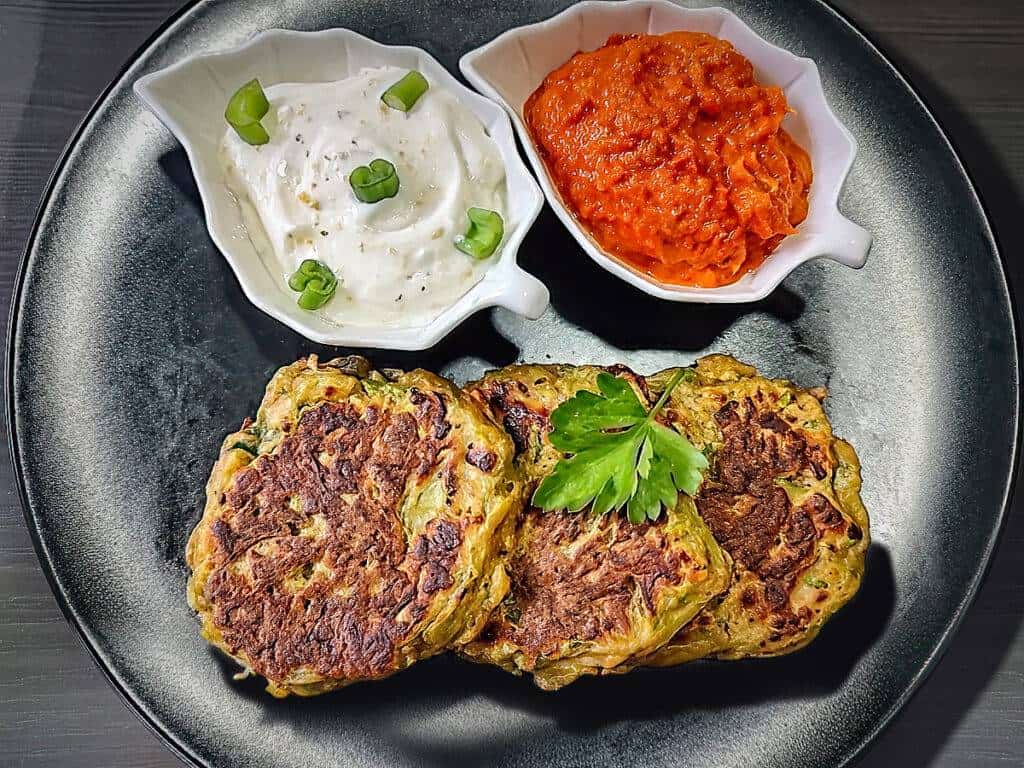 Finished air fryer zucchini fritters with dipping sauce