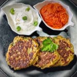 Finished air fryer zucchini fritters with dipping sauce