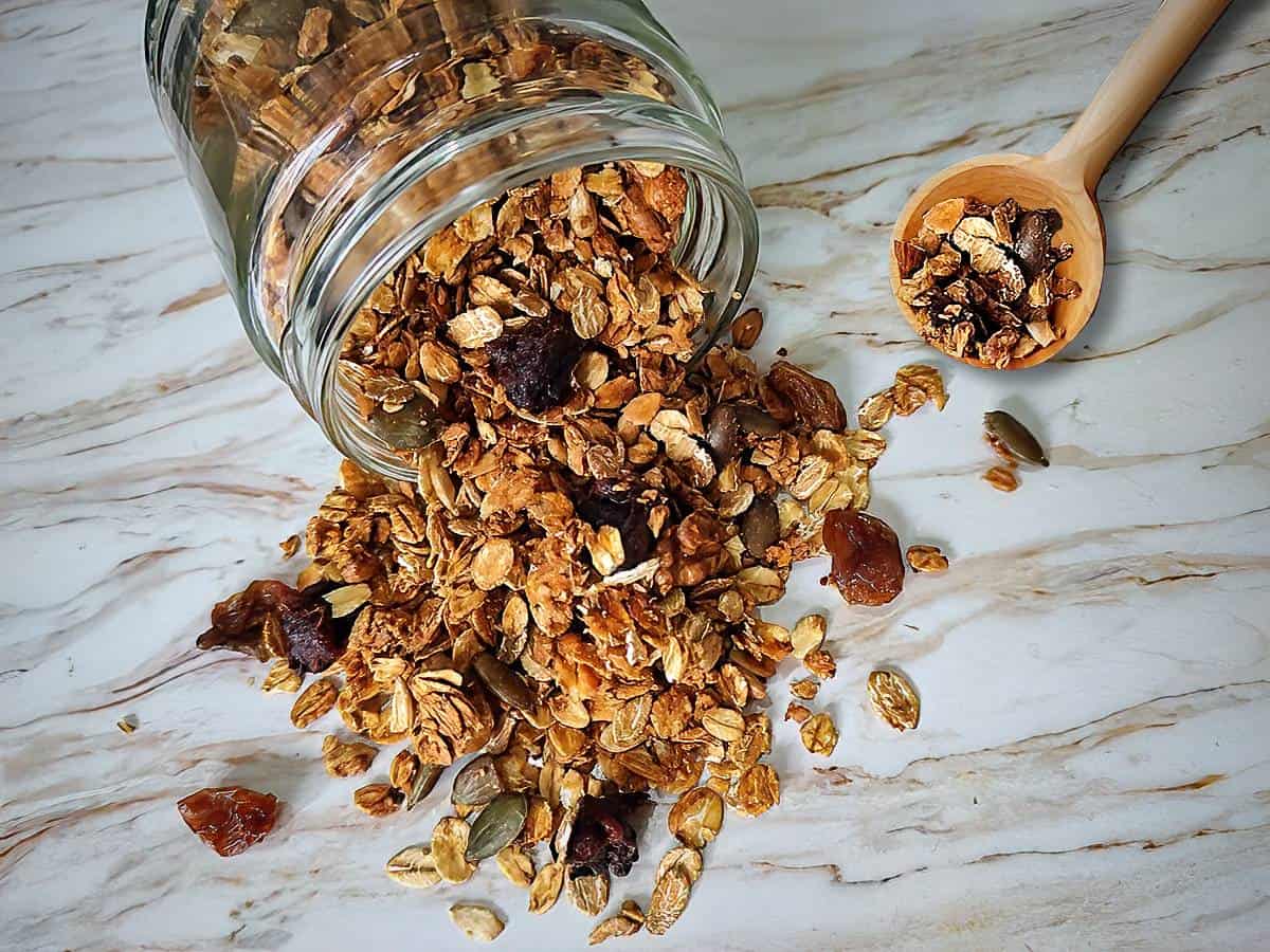 Homemade vegan granola in clear glass jar