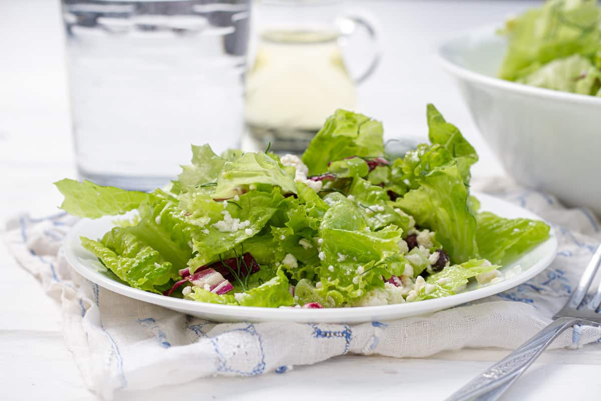 Maroulosalata salad on white plate with dressing