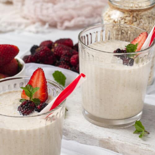 overnight oats in glass jar topped with strawberries