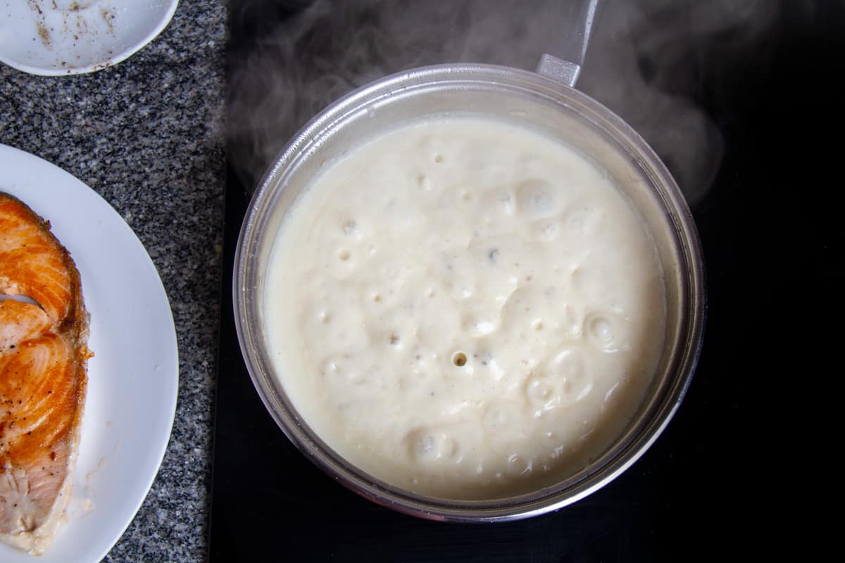 preparing creamy alfredo sauce